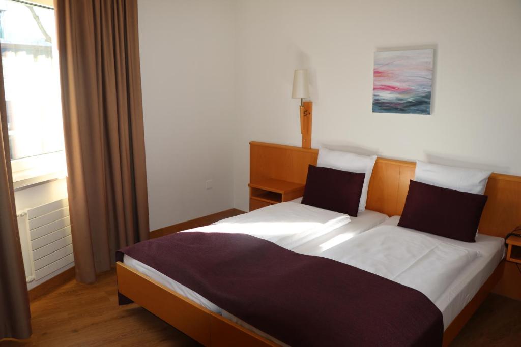 Postel nebo postele na pokoji v ubytování Olympia Hotel Zurich