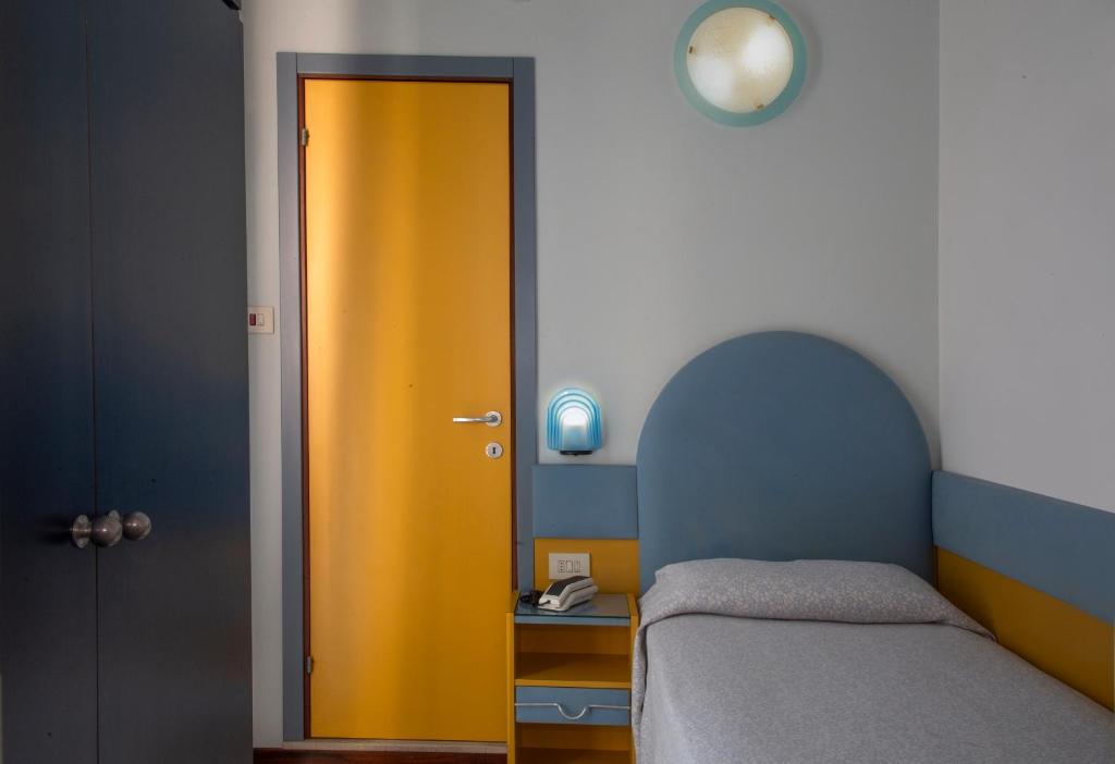 Postel nebo postele na pokoji v ubytování Hotel Norma