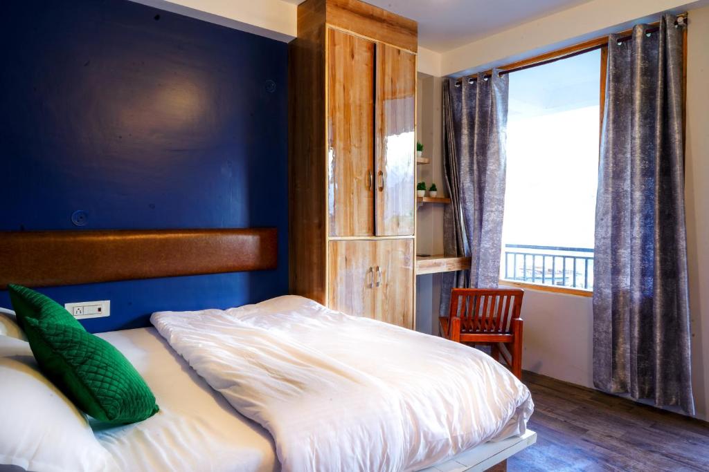 Postel nebo postele na pokoji v ubytování Bros Hostel & Yaara Cafe