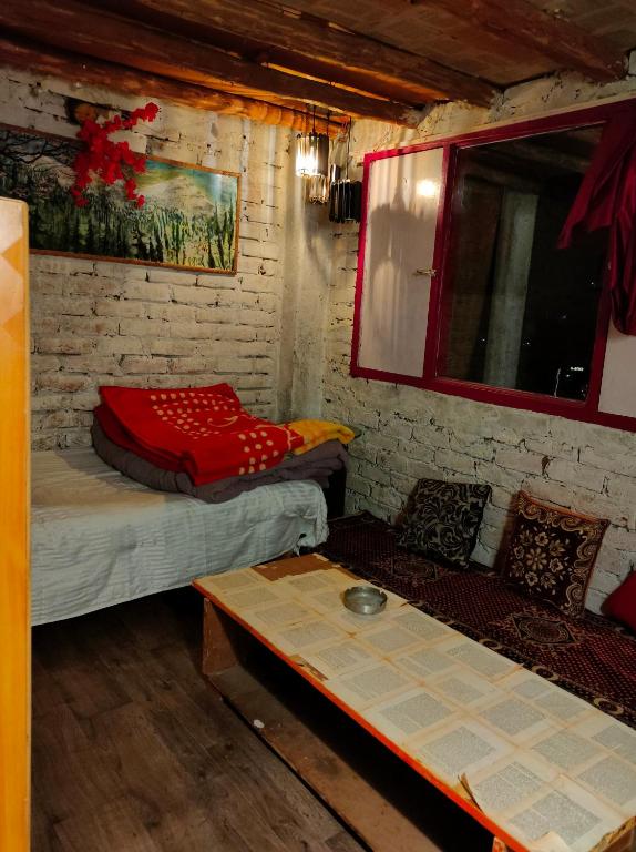 Postel nebo postele na pokoji v ubytování Bros Hostel & Yaara Cafe