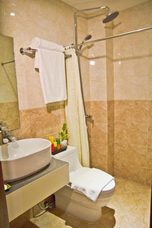 Koupelna v ubytování Canberry Hotel
