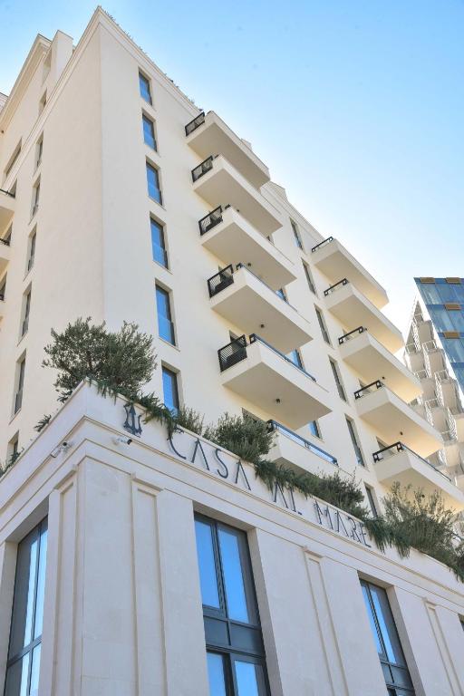 a building with the sign on top of it at CASA AL MARE RESIDENCE in Bečići