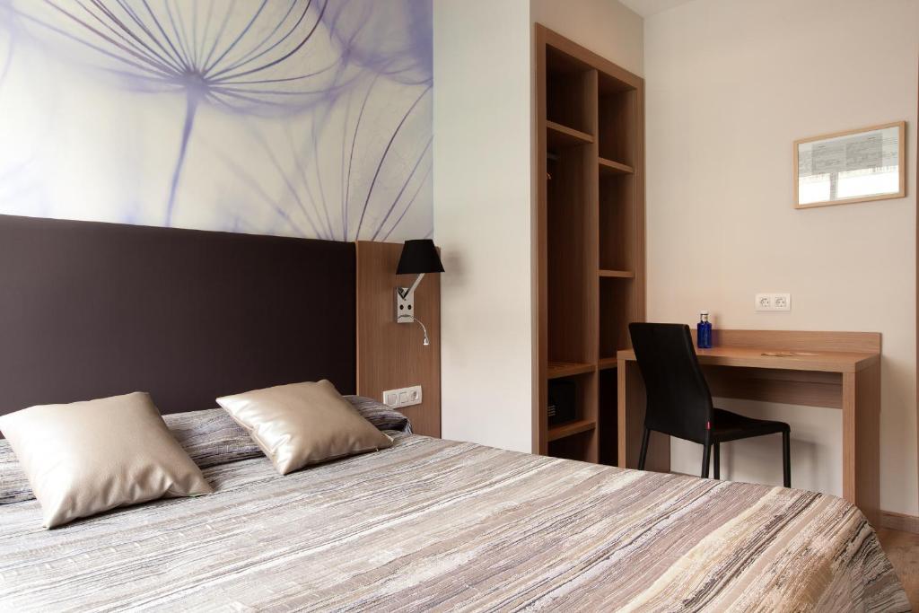 Postel nebo postele na pokoji v ubytování Hostal Centric