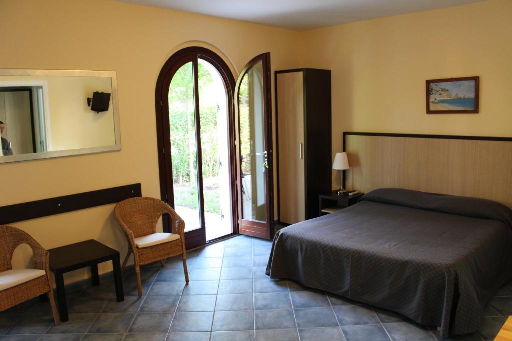 Postel nebo postele na pokoji v ubytování La Piazzetta Affittacamere B&B