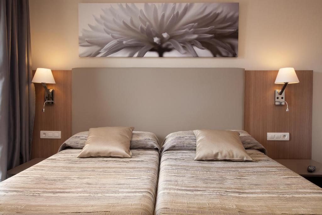 Postel nebo postele na pokoji v ubytování Hostal Centric