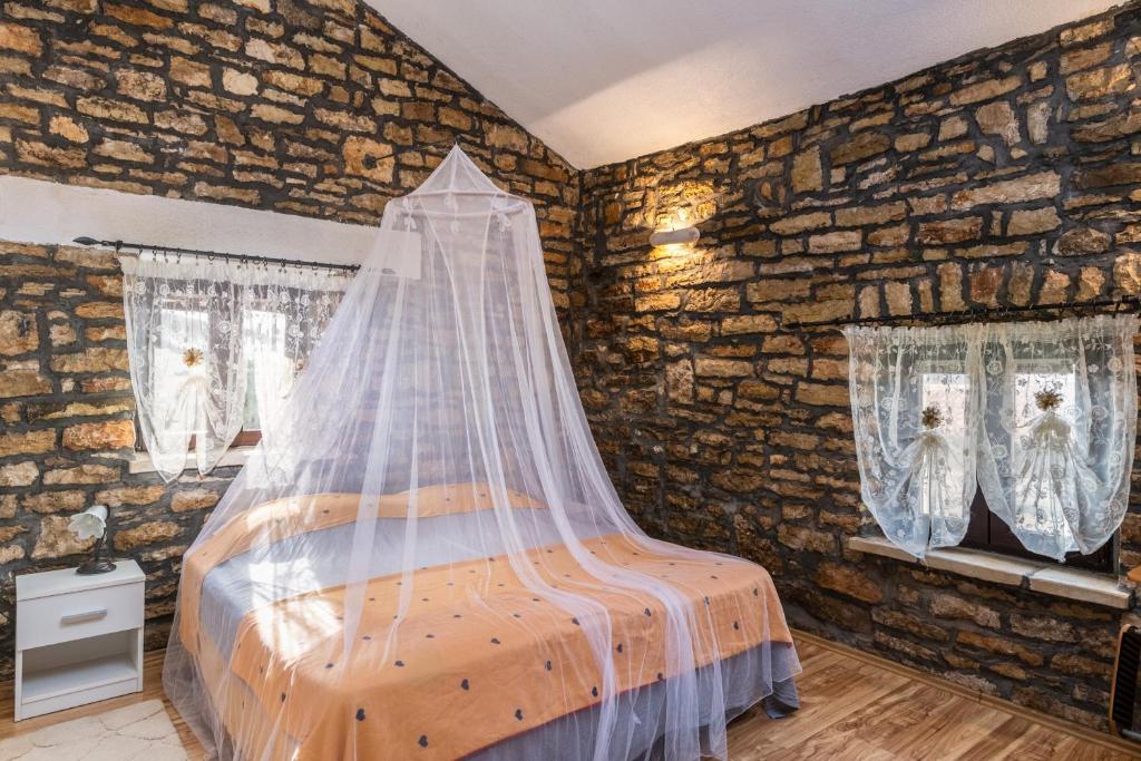 Posteľ alebo postele v izbe v ubytovaní Apartment Larca