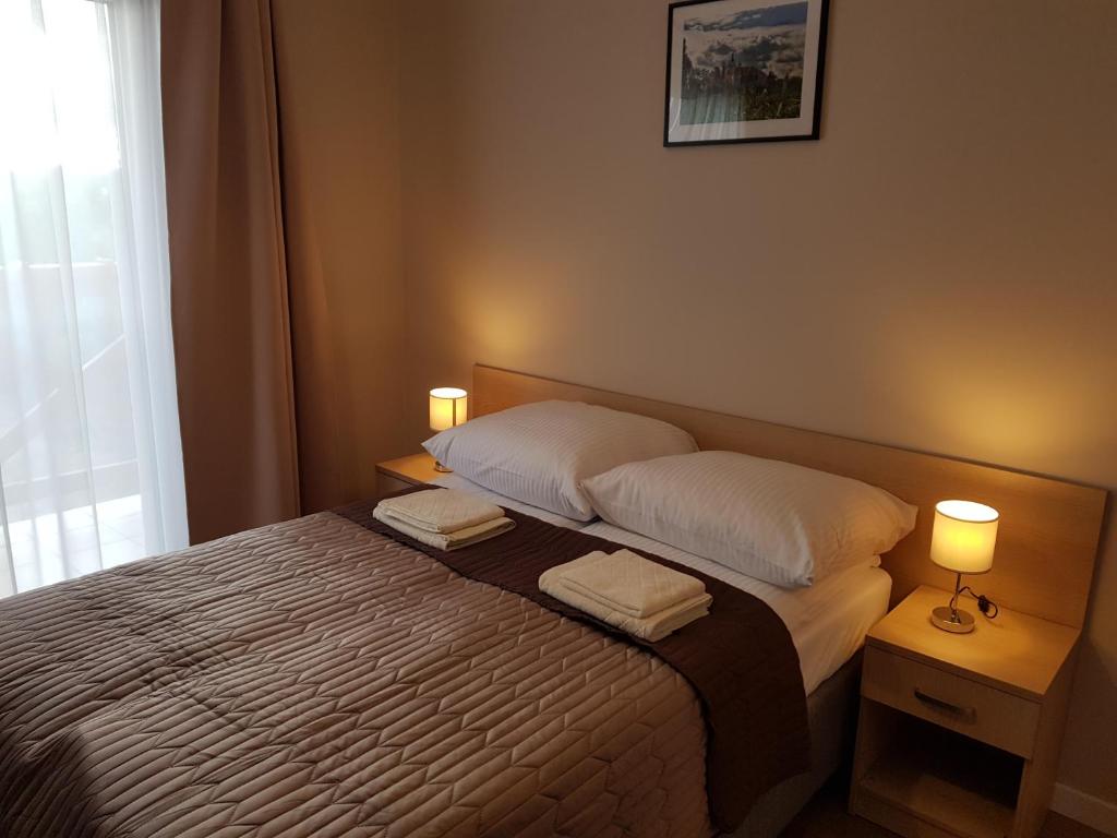 Postel nebo postele na pokoji v ubytování Willa Polesie