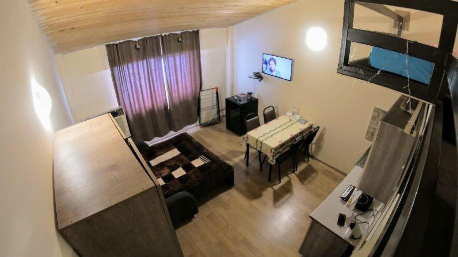 an overhead view of a living room with a bed and a table at Mary Apartment Gudauri Residence in Gudauri