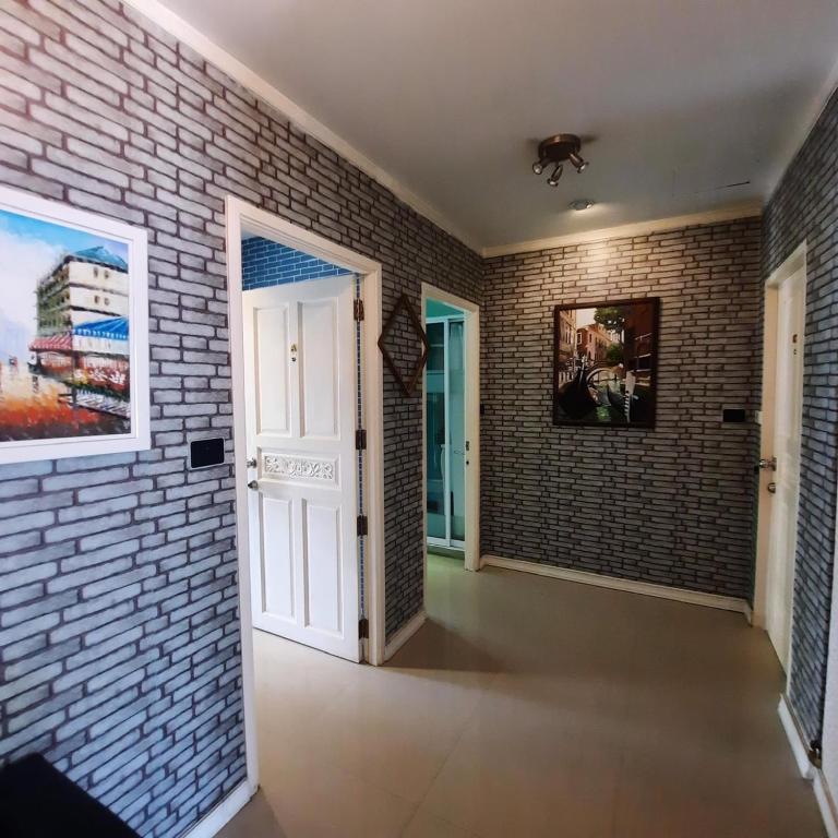 Postel nebo postele na pokoji v ubytování Mooz Huahin Bed & Breakfast