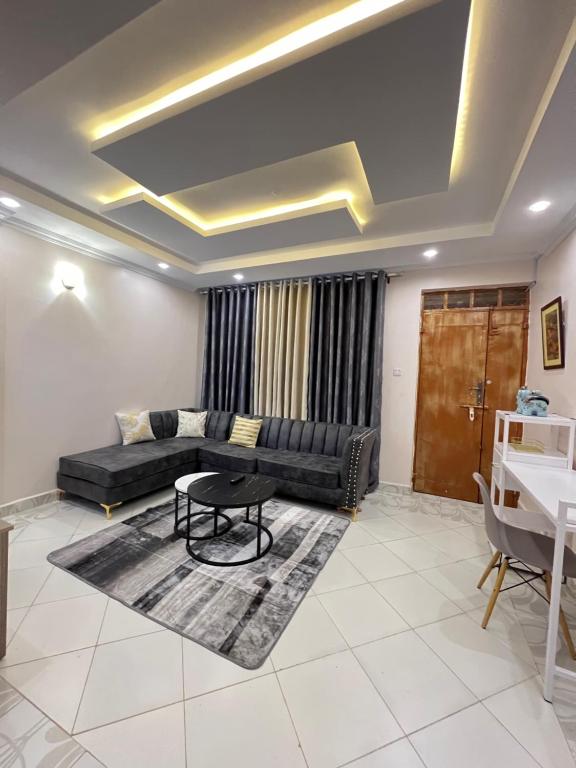 a living room with a couch and a table at Regency Stays in Eldoret
