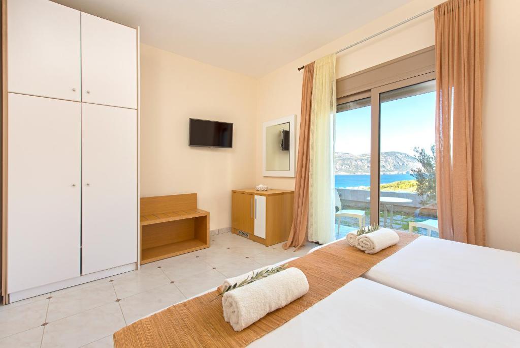 Postel nebo postele na pokoji v ubytování Renata's Villas