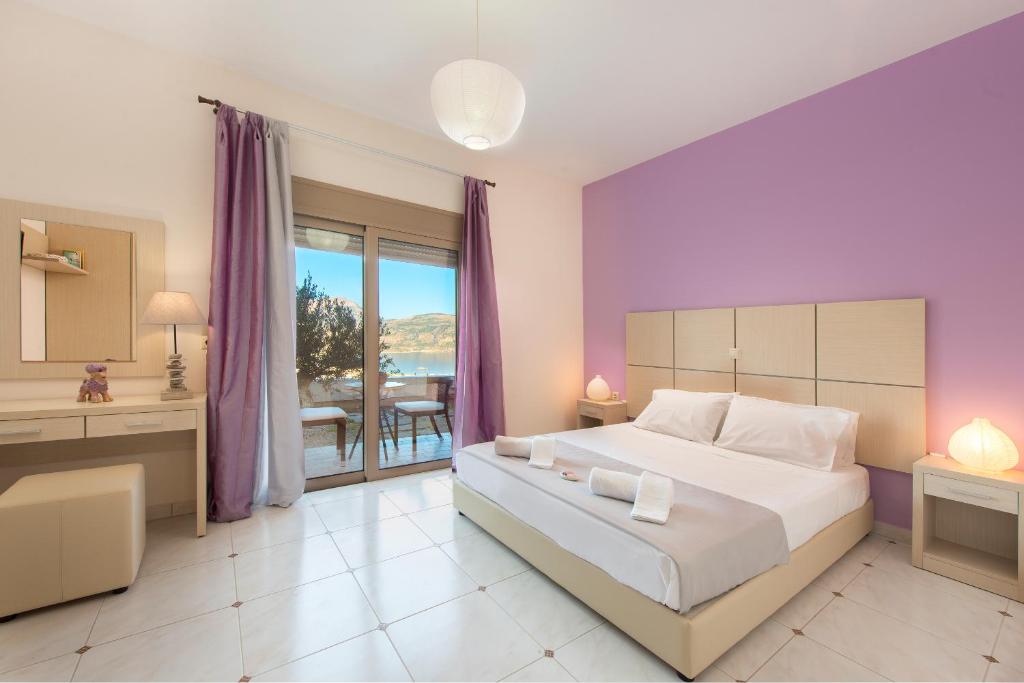 Postel nebo postele na pokoji v ubytování Renata's Villas