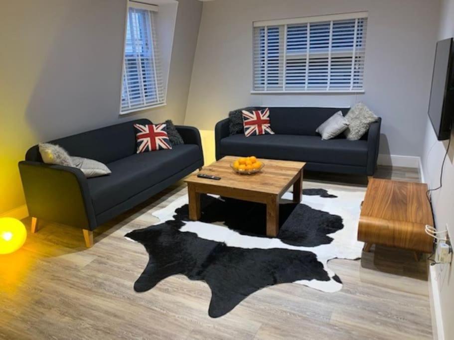 a living room with two couches and a coffee table at Plymouth city centre apartment near Theatre Royal in Plymouth