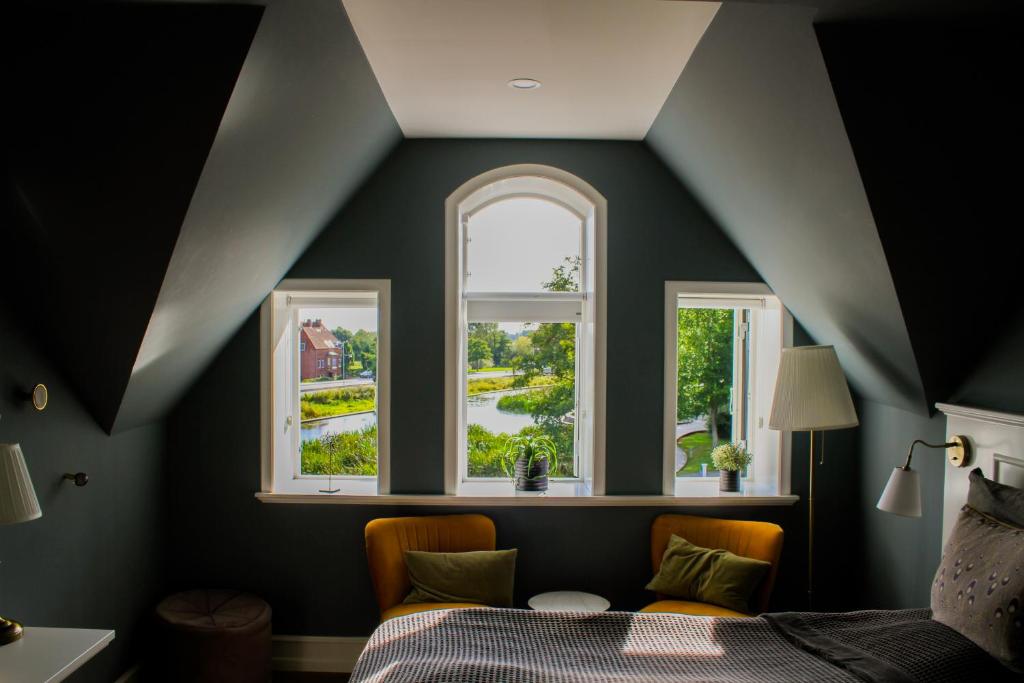 Postel nebo postele na pokoji v ubytování Hostrups Hotel
