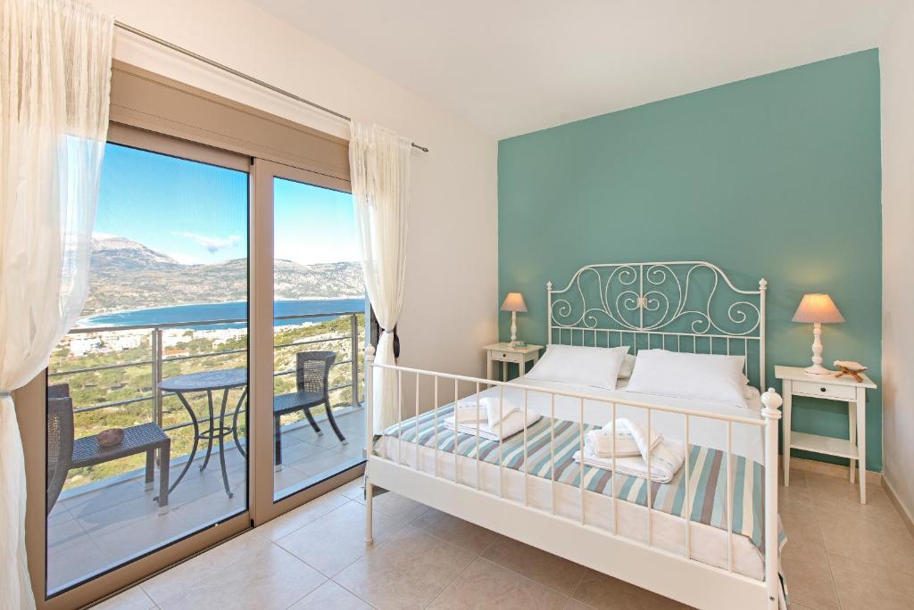 Postel nebo postele na pokoji v ubytování Renata's Villas