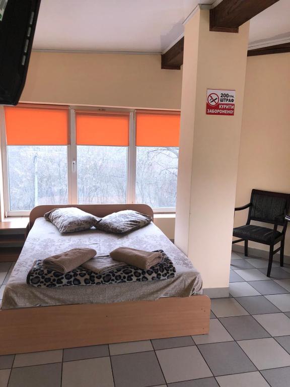 Postel nebo postele na pokoji v ubytování Мотель "Євро"