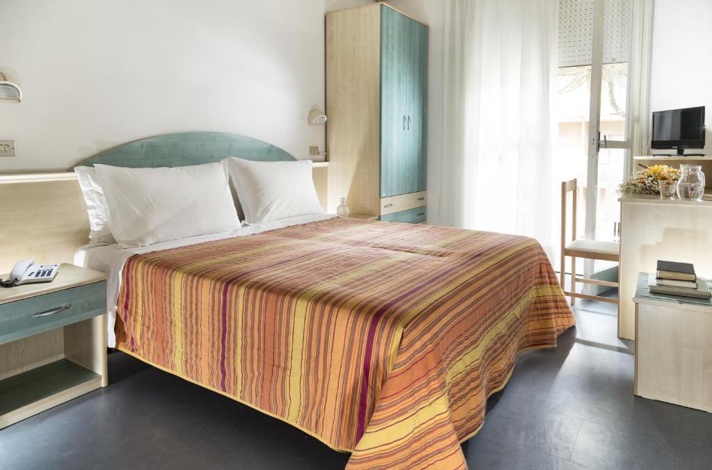 Postel nebo postele na pokoji v ubytování Park Hotel Pineta