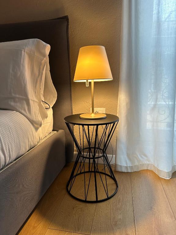 Posteľ alebo postele v izbe v ubytovaní Domus Suites Verona