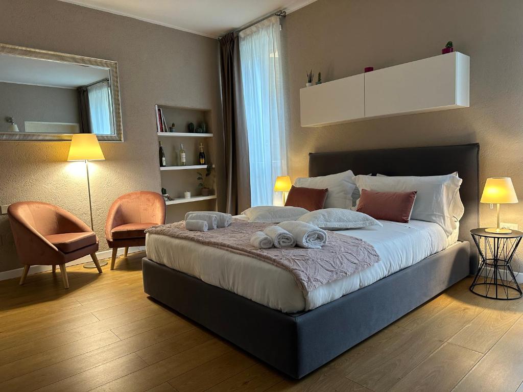 Posteľ alebo postele v izbe v ubytovaní Domus Suites Verona