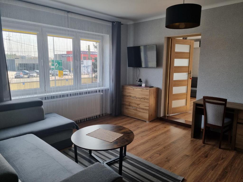 Televízia a/alebo spoločenská miestnosť v ubytovaní Willa "Aparthause" E-Apartamenty