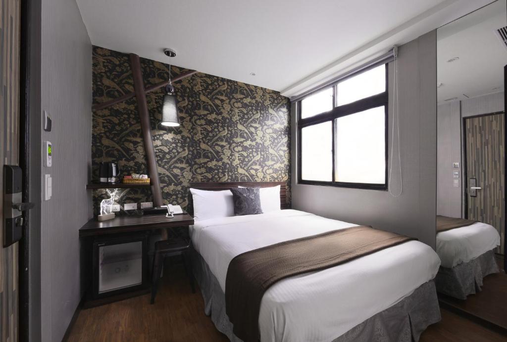 Postel nebo postele na pokoji v ubytování Herb Art Hotel