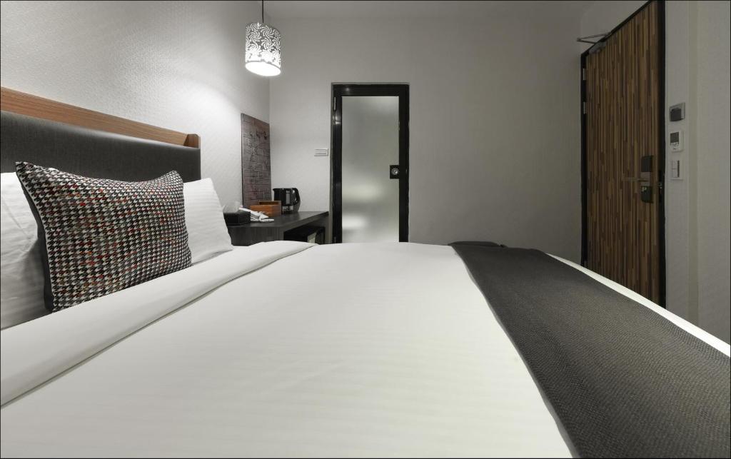 Postel nebo postele na pokoji v ubytování Herb Art Hotel
