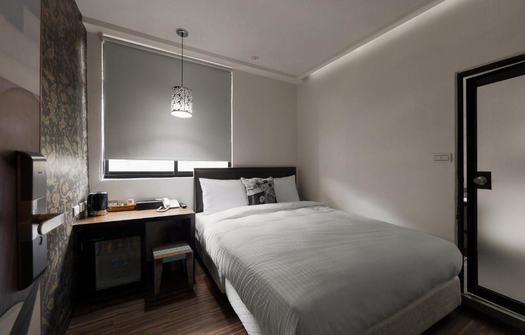 Postel nebo postele na pokoji v ubytování Herb Art Hotel