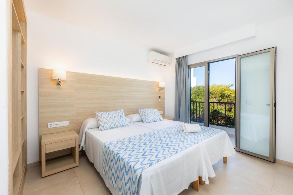 Postel nebo postele na pokoji v ubytování Apartamento Aquamarina 5