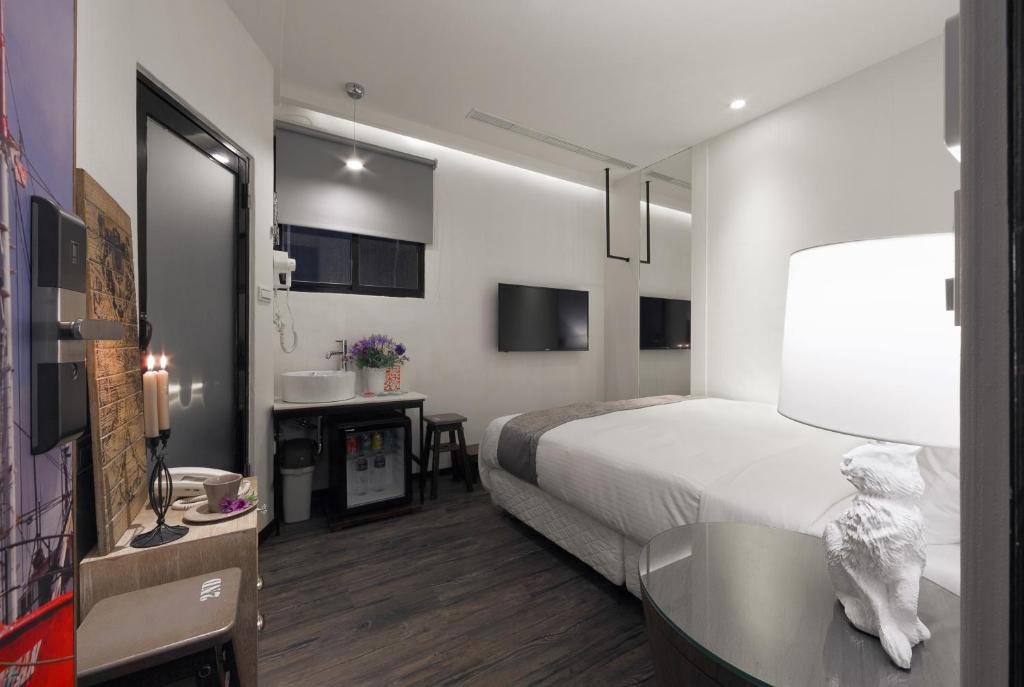 Postel nebo postele na pokoji v ubytování Herb Art Hotel