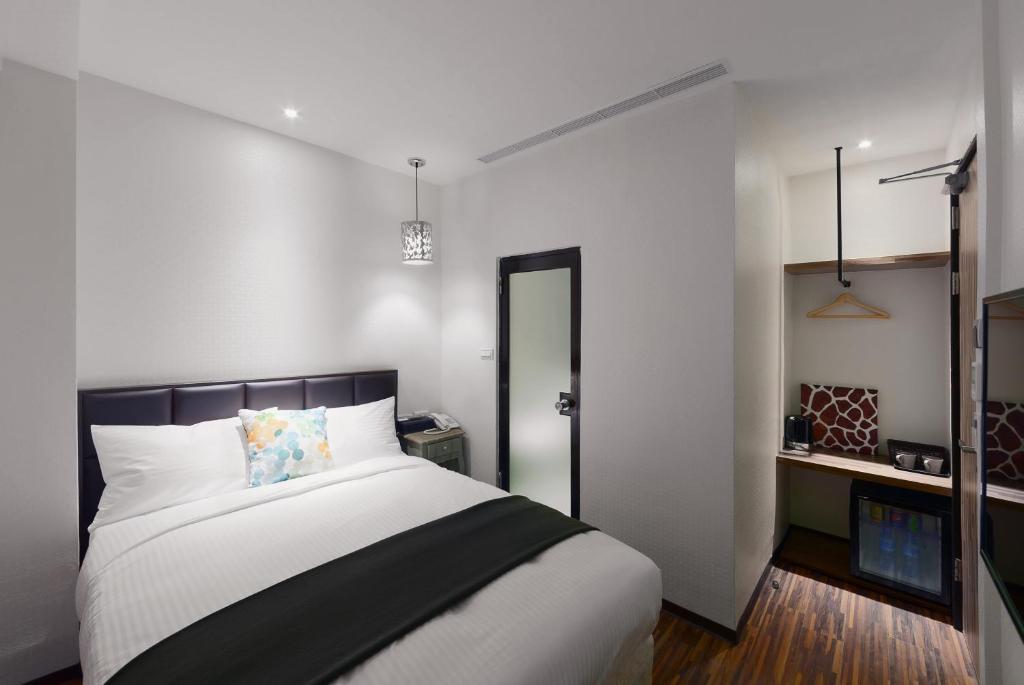 Postel nebo postele na pokoji v ubytování Herb Art Hotel
