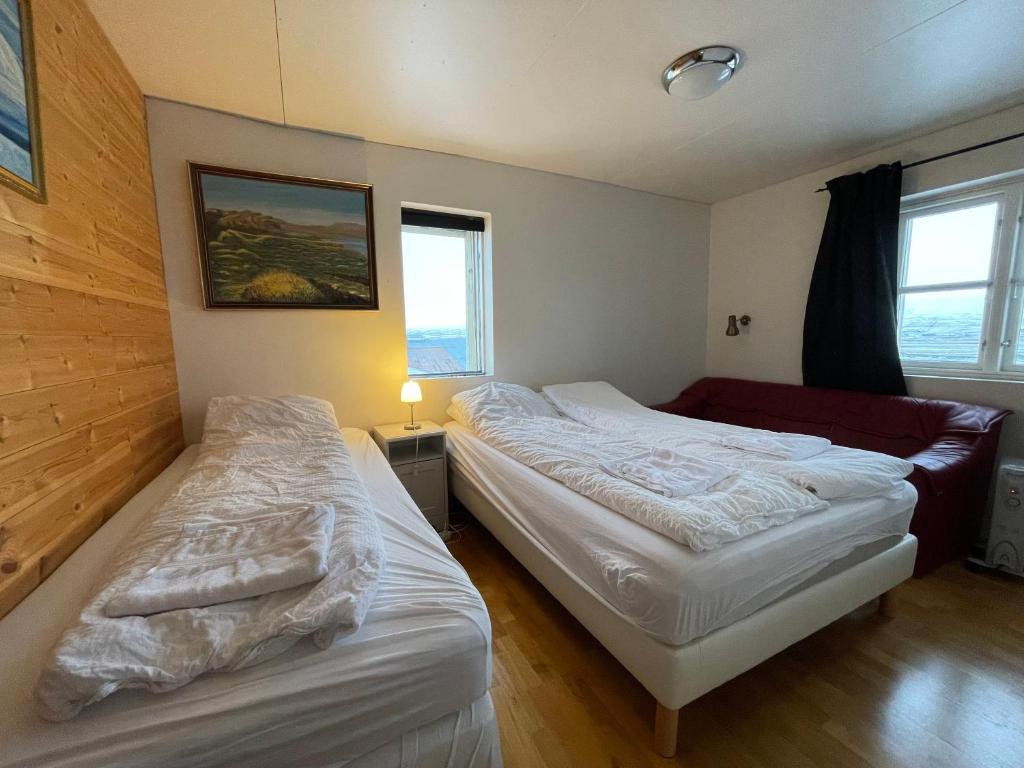Postel nebo postele na pokoji v ubytování Fagrabrekka Guesthouse