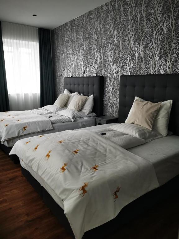 Postel nebo postele na pokoji v ubytování H23 Hotel Stuttgart