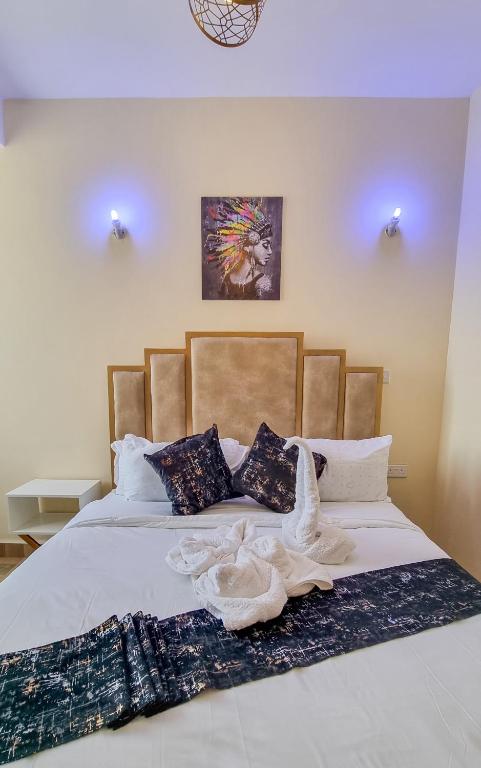 Postel nebo postele na pokoji v ubytování Luxury 1Br Apartment with Secure Parking & Lift Nakuru