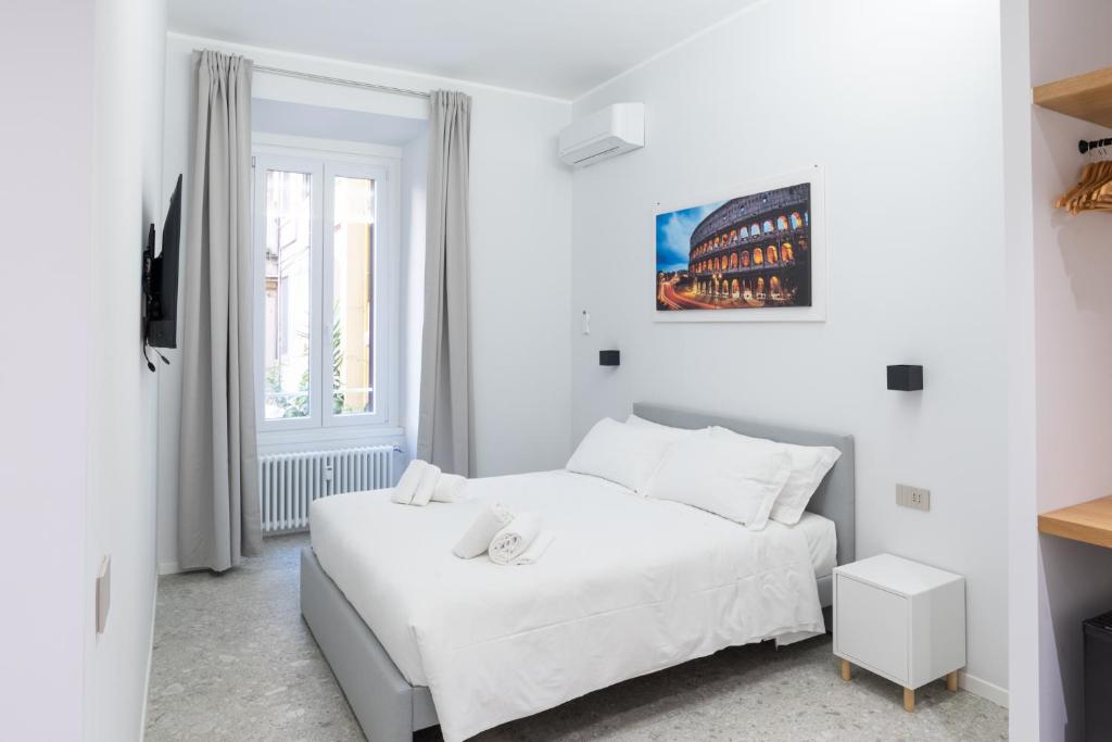 Ліжко або ліжка в номері White Home Suite and Rooms