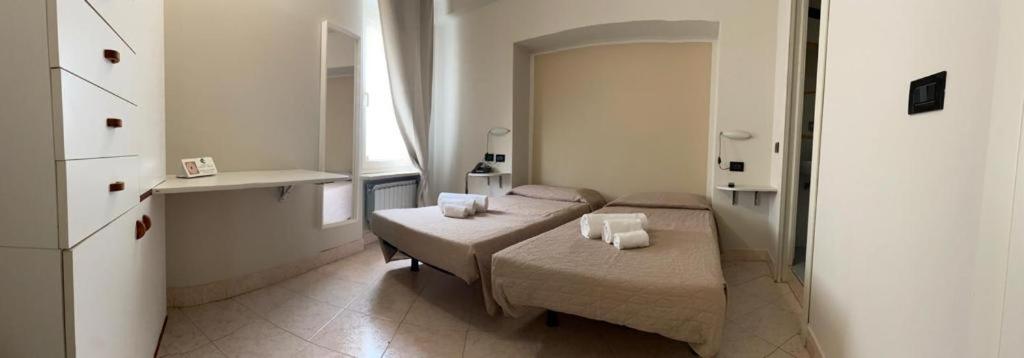 Postel nebo postele na pokoji v ubytování Hotel Cumilì
