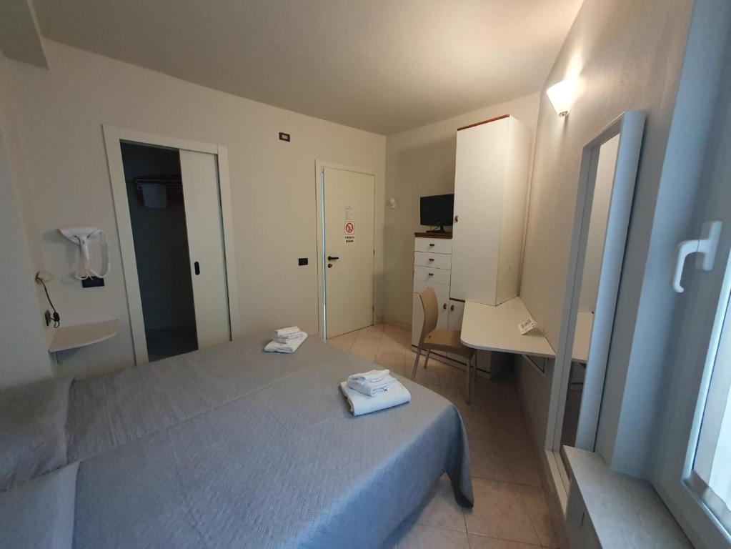 Postel nebo postele na pokoji v ubytování Hotel Cumilì