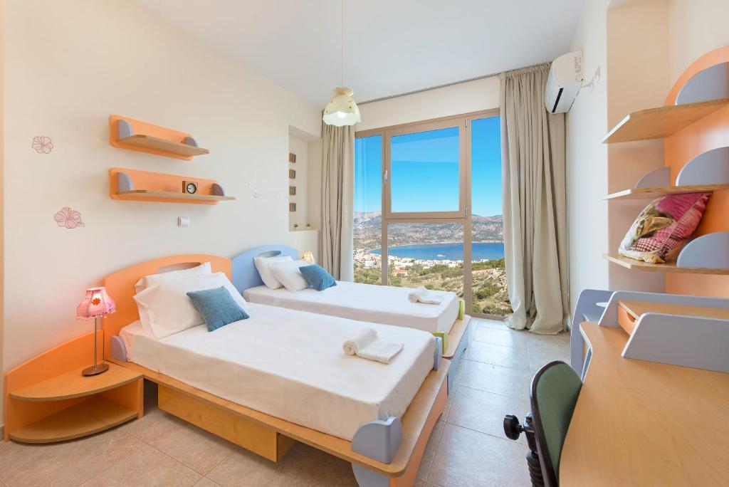 Postel nebo postele na pokoji v ubytování Renata's Villas