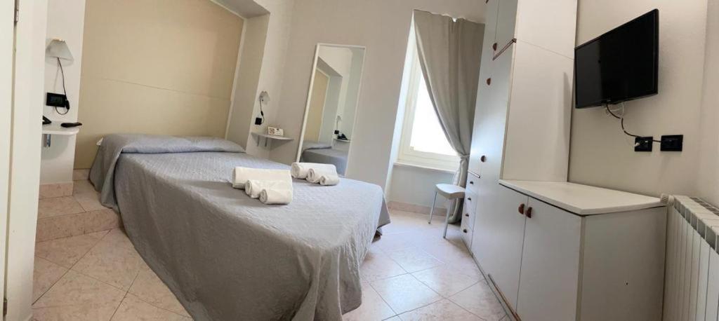 Postel nebo postele na pokoji v ubytování Hotel Cumilì