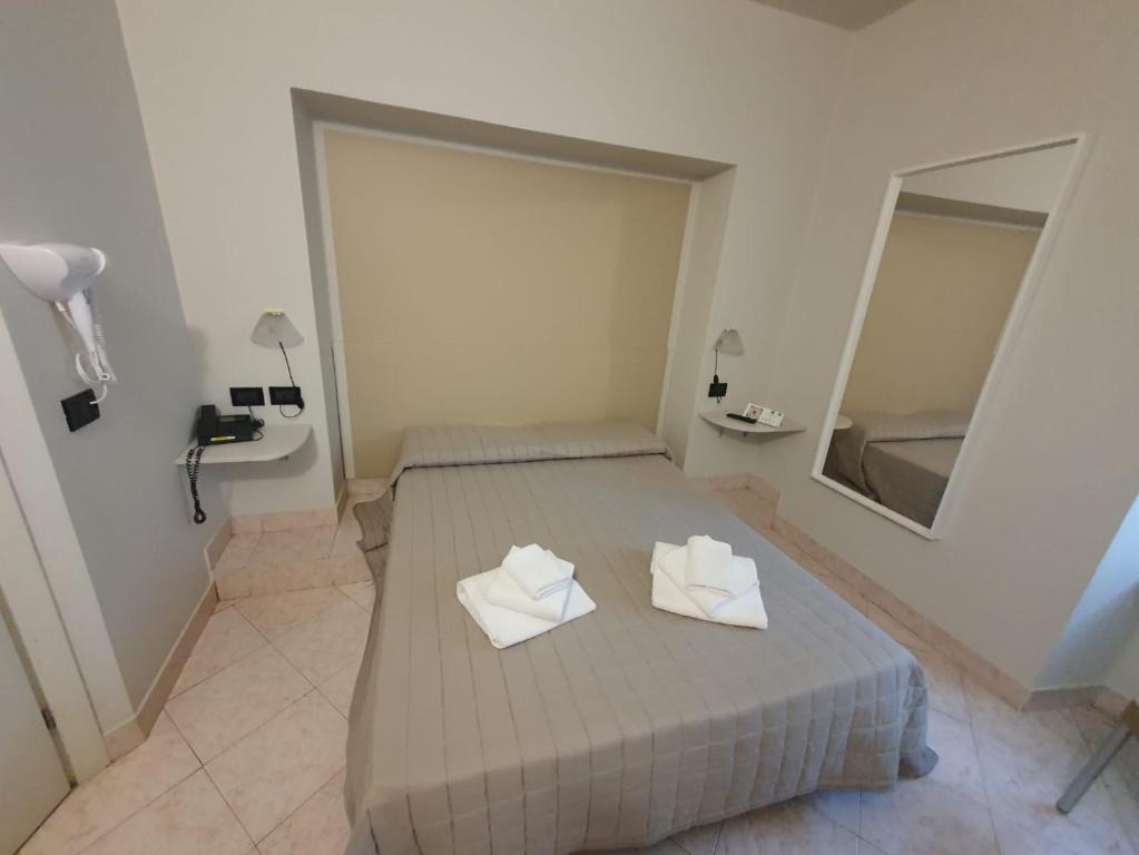 Postel nebo postele na pokoji v ubytování Hotel Cumilì