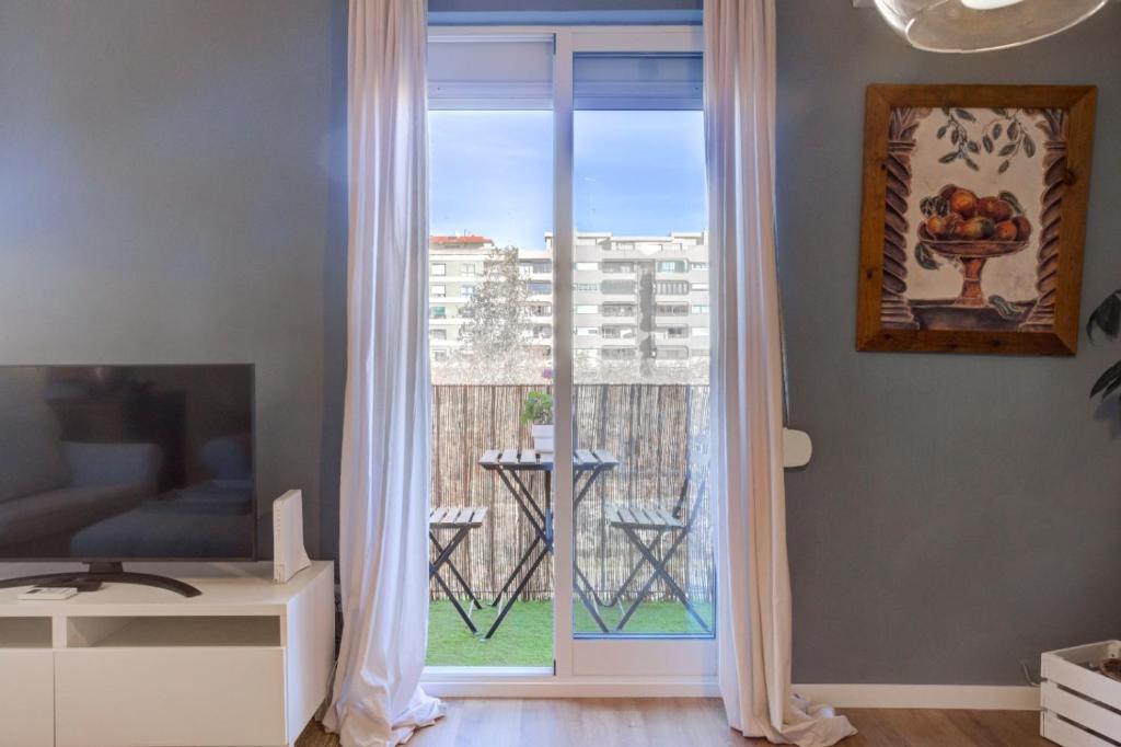 Televízia a/alebo spoločenská miestnosť v ubytovaní Vivir en Valencia