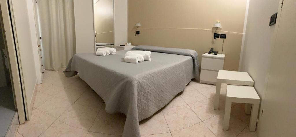 Postel nebo postele na pokoji v ubytování Hotel Cumilì