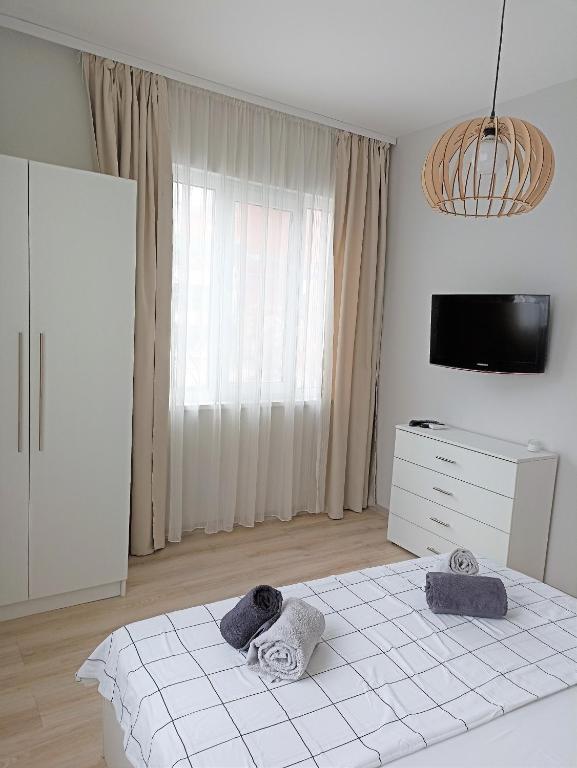 A bed or beds in a room at Apartment SEA HOLIDAYS