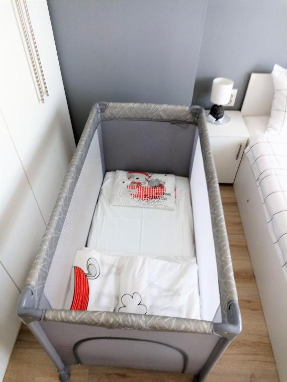 A bed or beds in a room at Apartment SEA HOLIDAYS