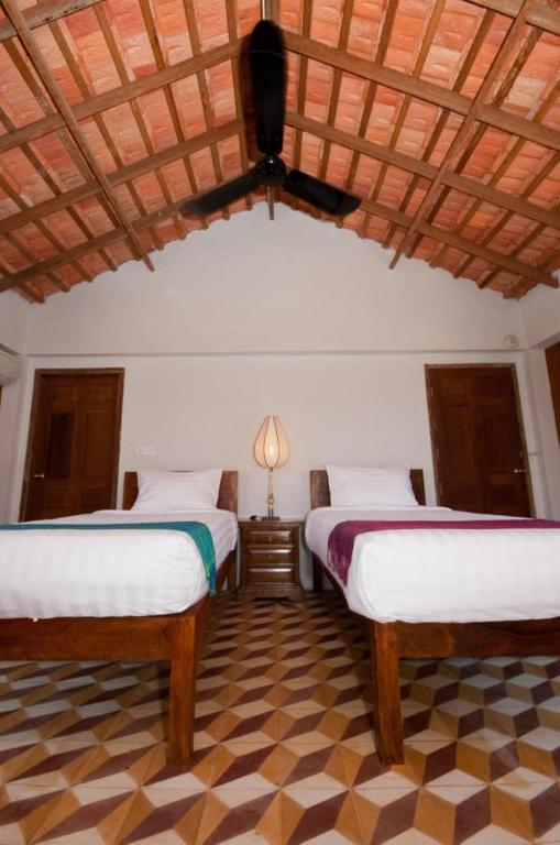 Postel nebo postele na pokoji v ubytování Bambu Hotel