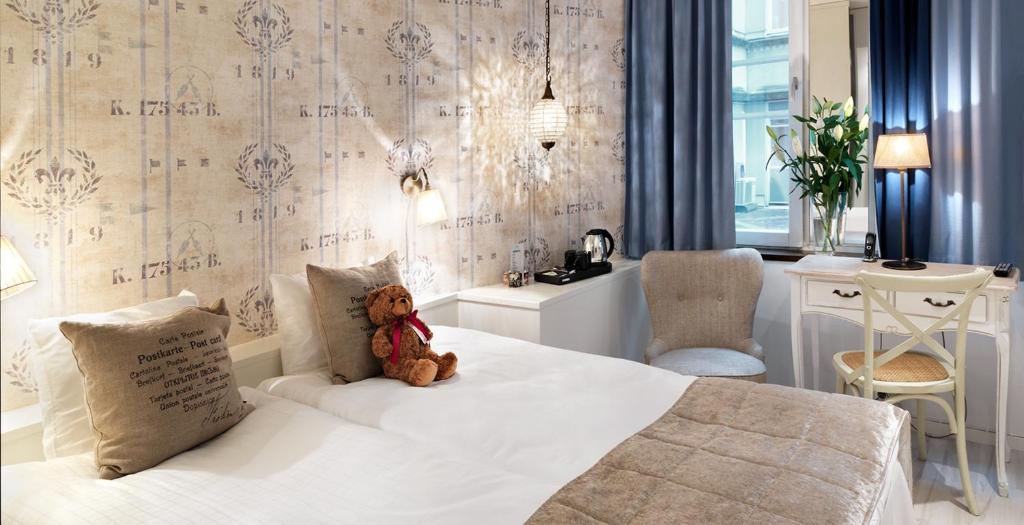 Postel nebo postele na pokoji v ubytování Freys Hotel