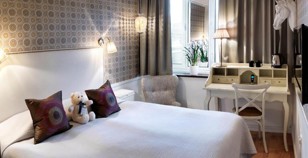 Postel nebo postele na pokoji v ubytování Freys Hotel