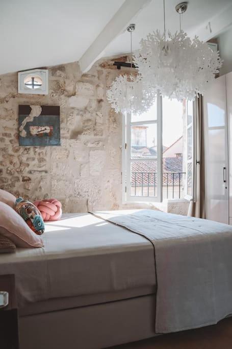 Posteľ alebo postele v izbe v ubytovaní Appartement 26 Arles centre