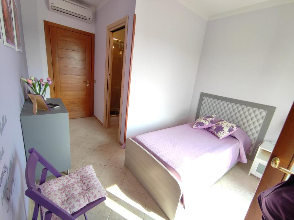A bed or beds in a room at Il Giardino delle Zagare