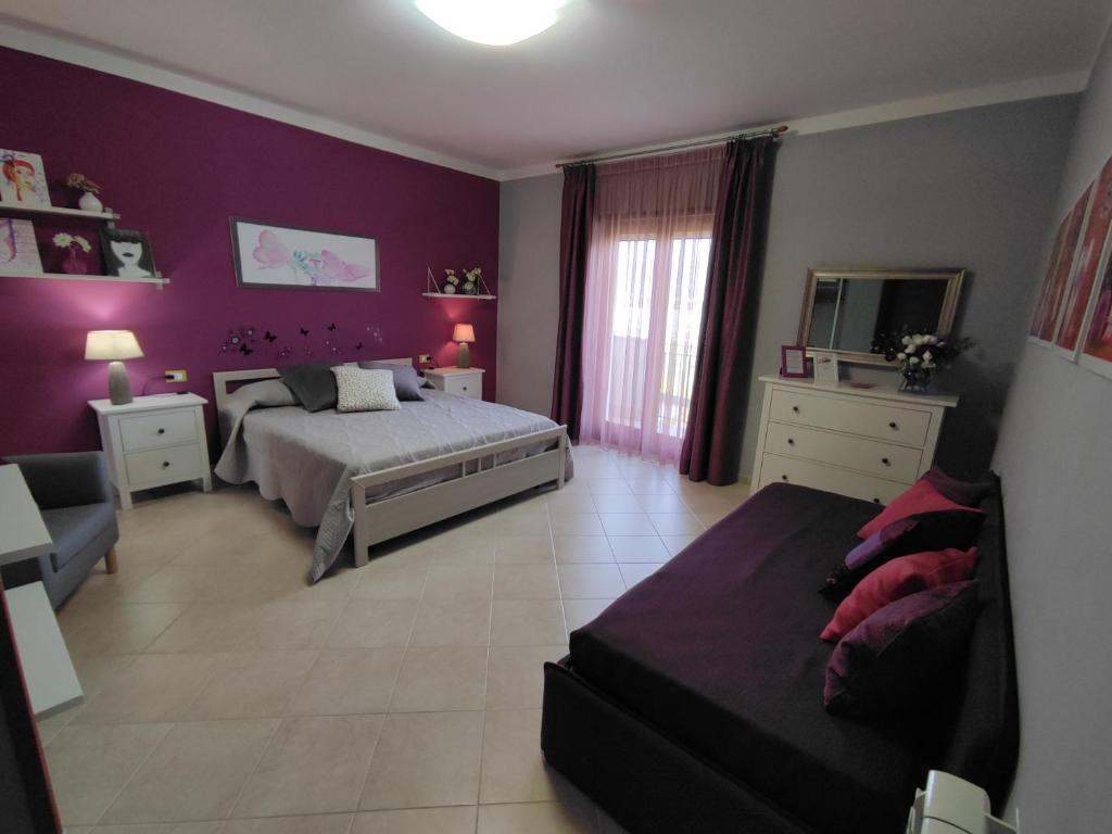 A bed or beds in a room at Il Giardino delle Zagare