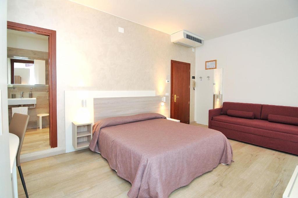 Postel nebo postele na pokoji v ubytování Hotel Da Mario